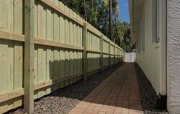 Are there any specific benefits of using wood picket fences over other wood fences?